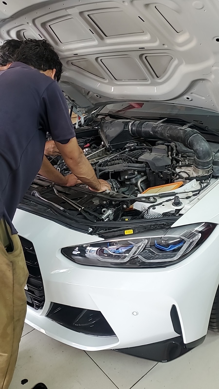 Car battery & car mechanic photo