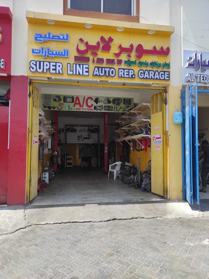 Super line auto repair garage And car battery change photo